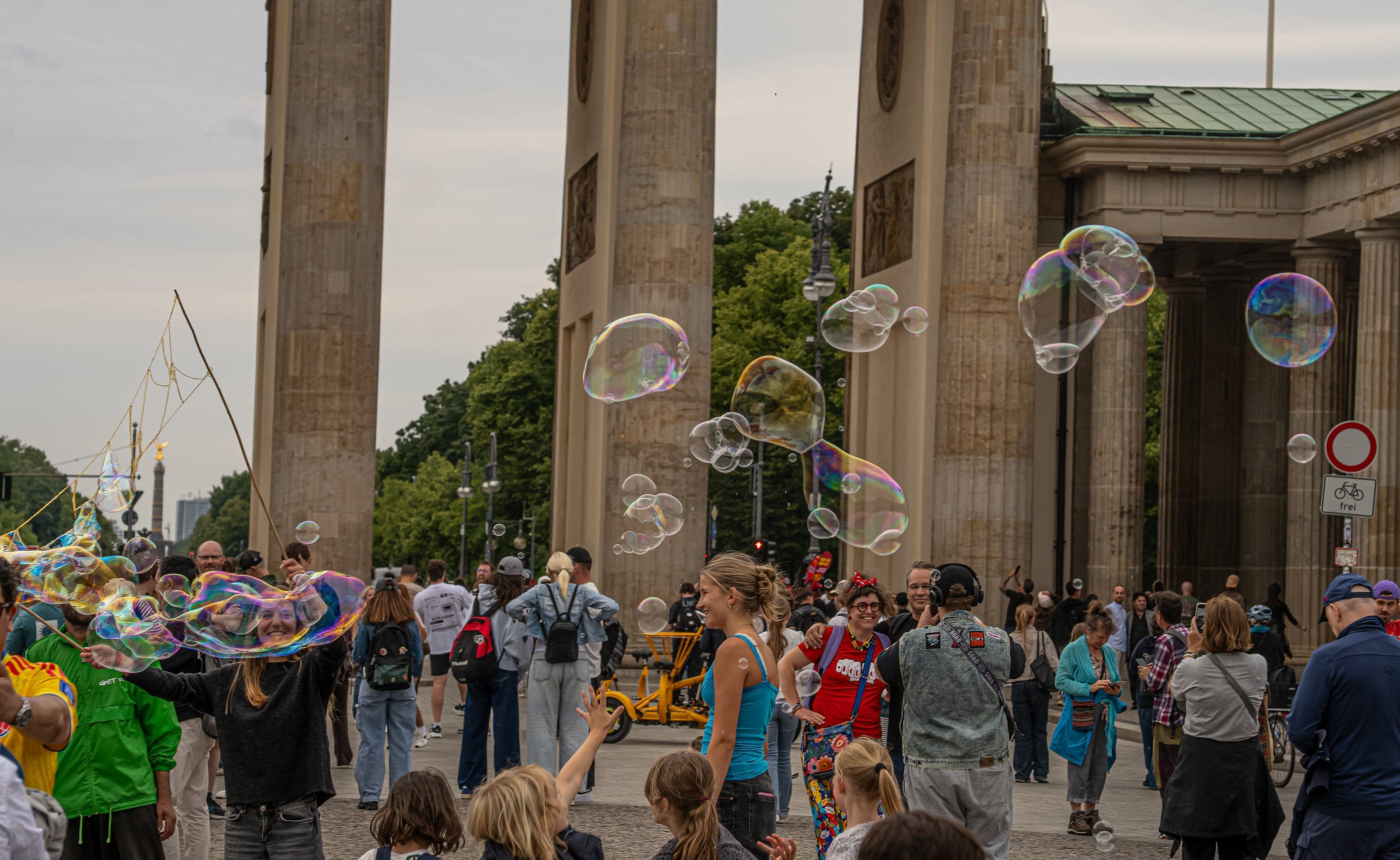 Soap bubbles drifting past the Brandenburg Gate